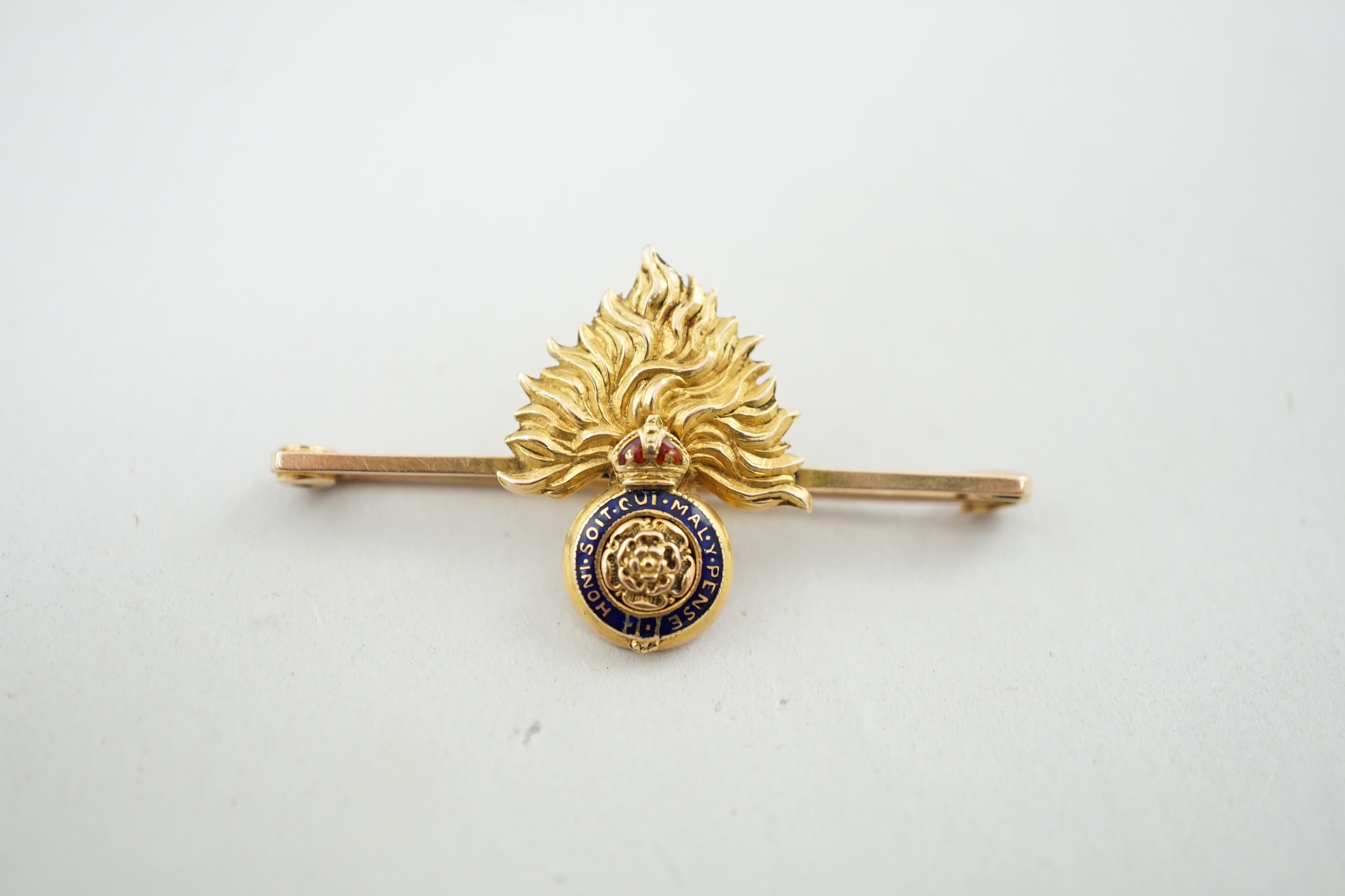 An Edwardian 18ct gold and two colour enamel Royal London Fusiliers sweethearts brooch